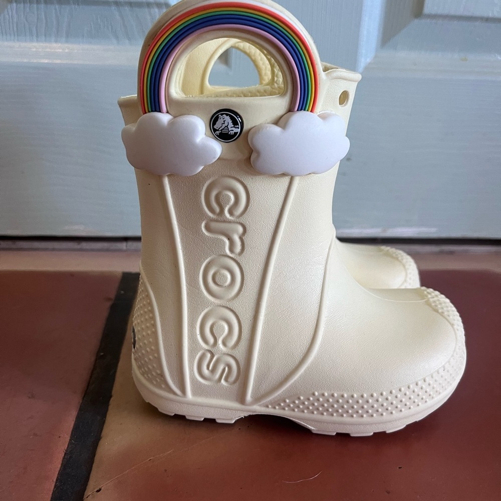 CROCS Kids Cream Rain Boot with Rainbow Handle and Cloud Accents